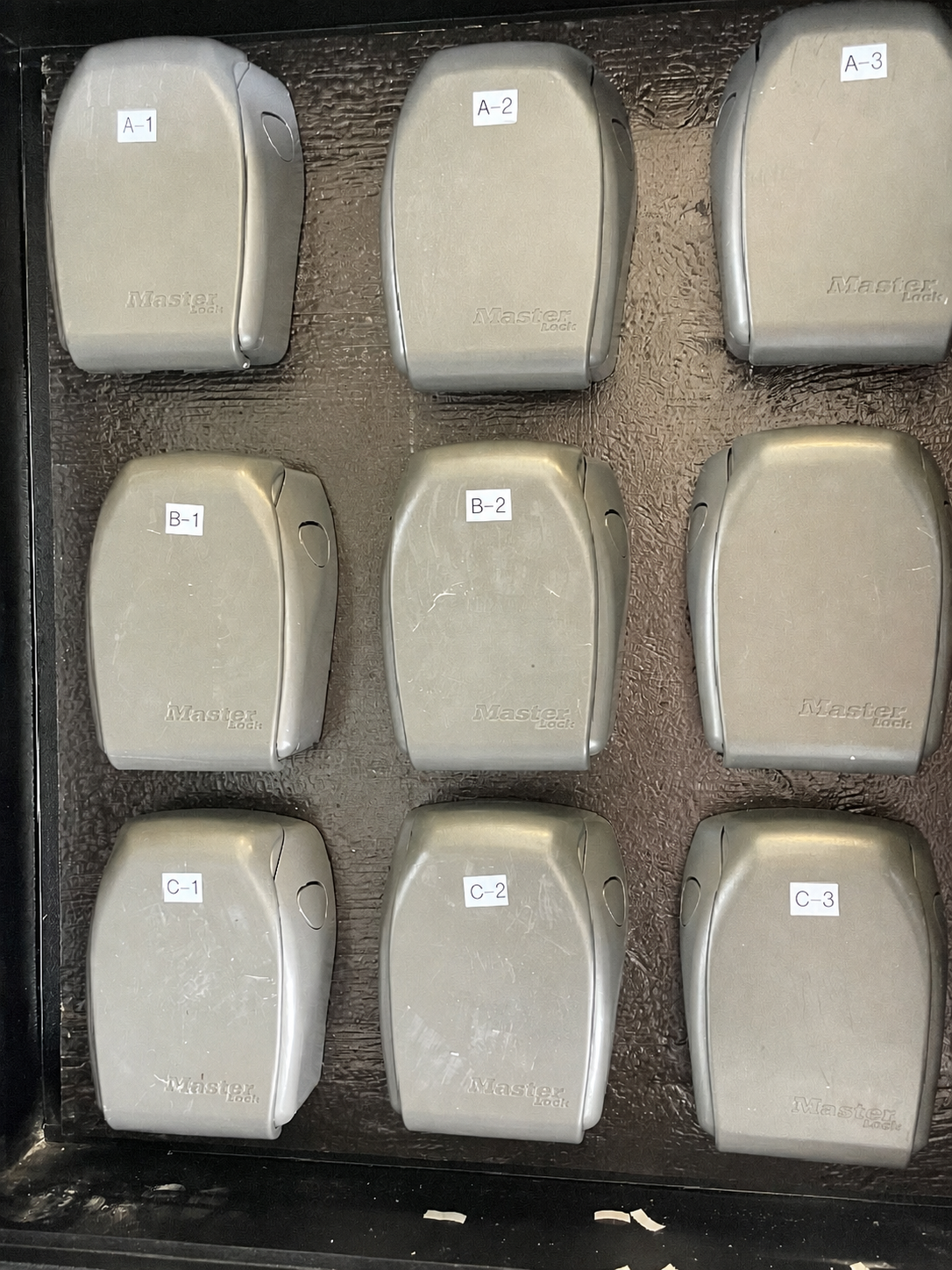 Inside the cabinet with numbered lockboxes