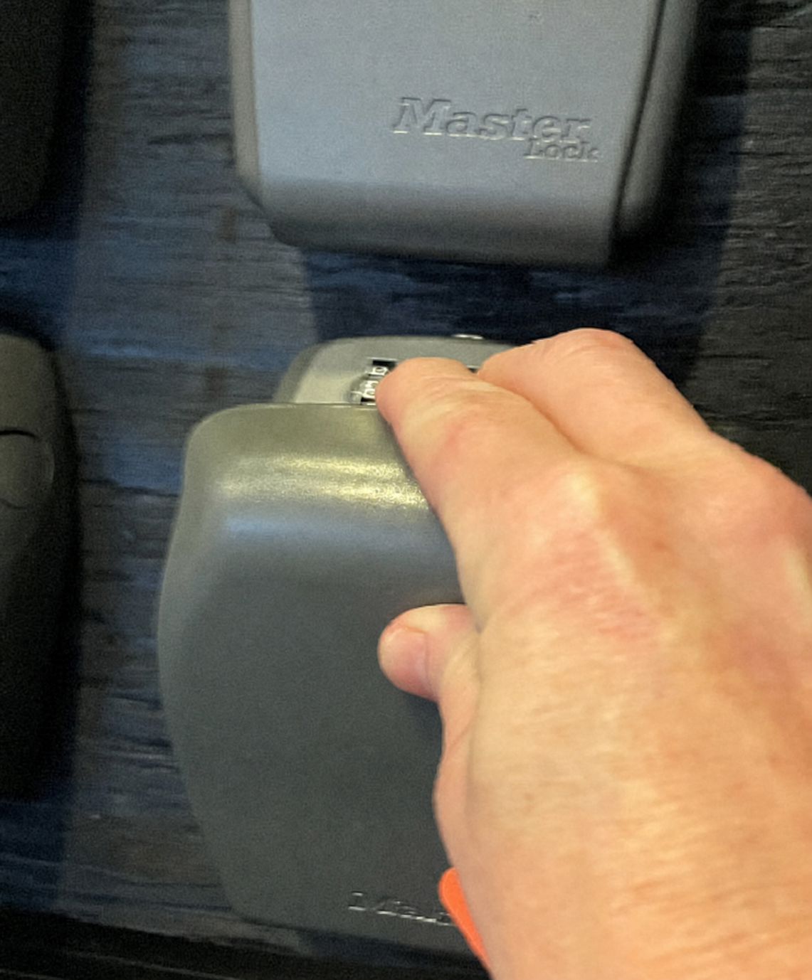 Pulling top cover forward to expose dials